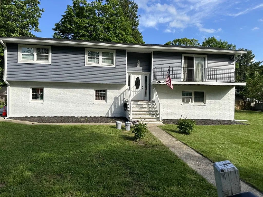 Completed home with new roof and siding