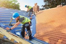 Roofers installing shingles